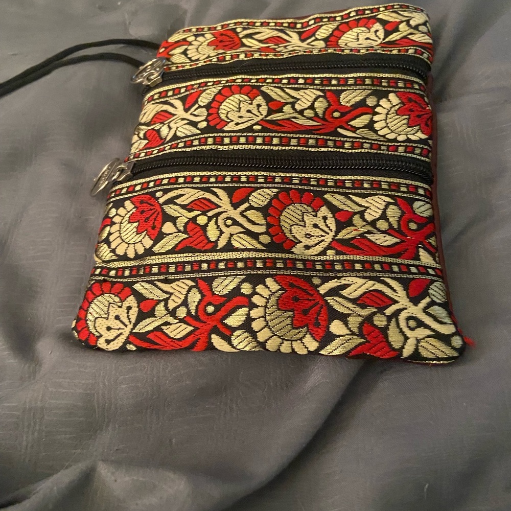 Elegant Red, Gold, and Black Floral pouch by Toni.
